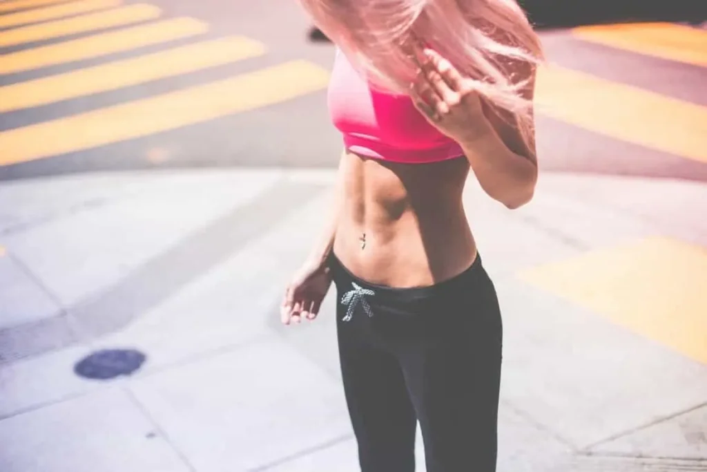 Woman with toned stomach after LA-EMS Body Sculpting Treatment Bedford Park