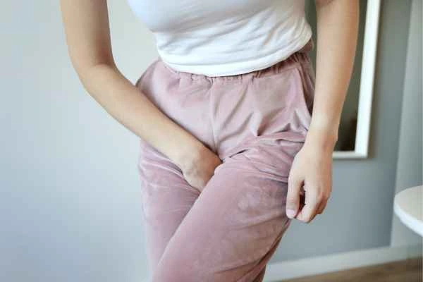 woman running for the toilet because of urinary incontinence Bedford Park